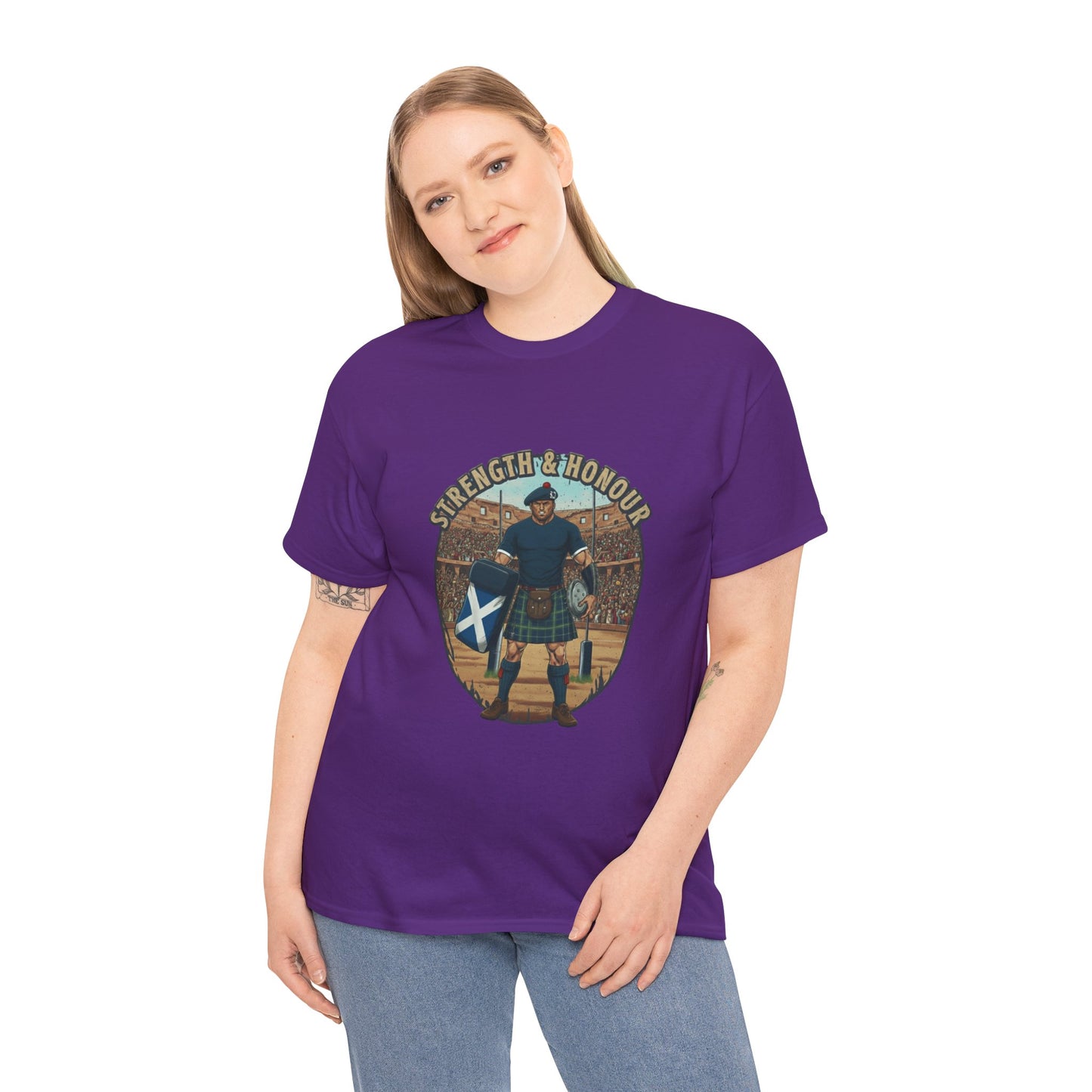Woman wearing a Purple t-shirt with a graphic of a Scottish rugby player wearing a kilt and `Strength & Honour` text on a white background
