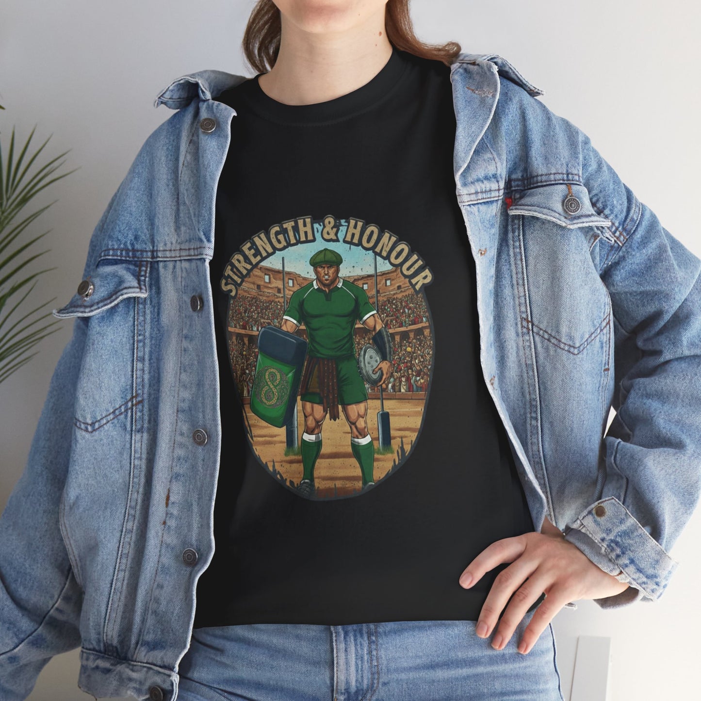 Lifestyle photo of a woman wearing Black t-shirt with a graphic of a Irish rugby player with `Strength & Honour` text on a white background