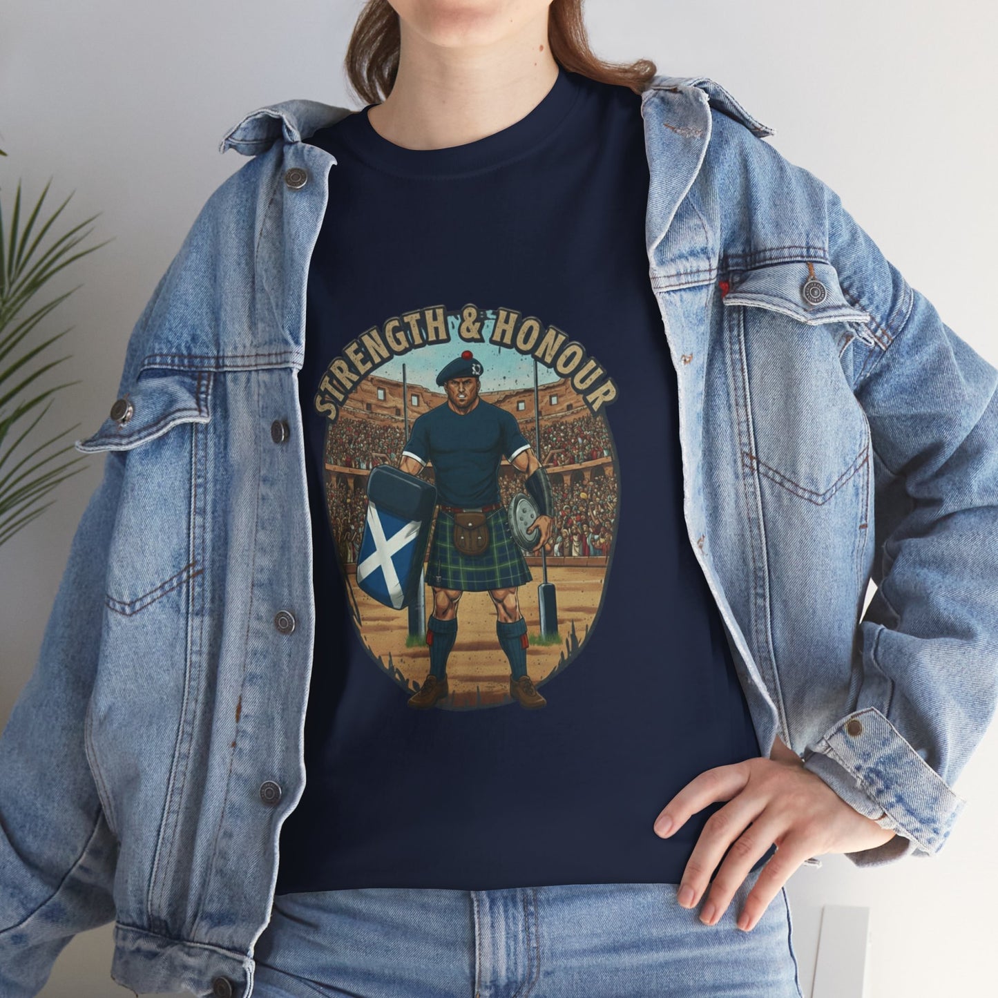 Lifestyle photo of a woman wearing a Navy t-shirt with a graphic of a Scottish rugby player wearing a kilt and `Strength & Honour` text on a white background