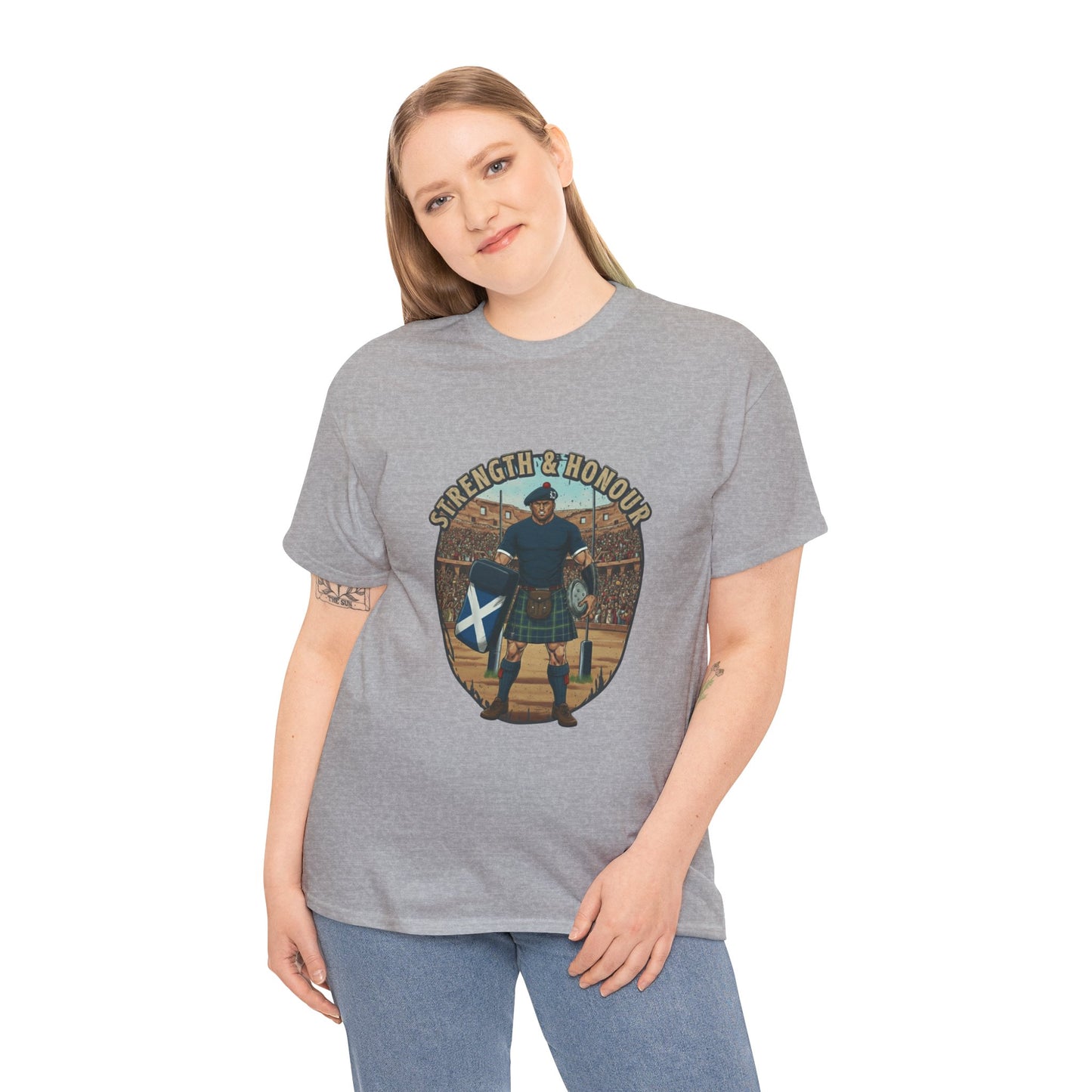 Woman wearing a grey t-shirt with a graphic of a Scottish rugby player wearing a kilt and `Strength & Honour` text on a white background