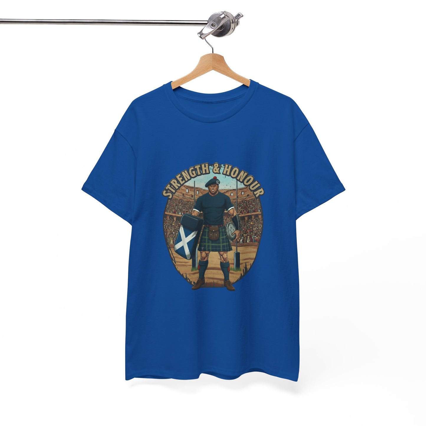 Blue t-shirt with a graphic of a Scottish rugby player wearing a kilt and `Strength & Honour` text on a white background, on a hanger.