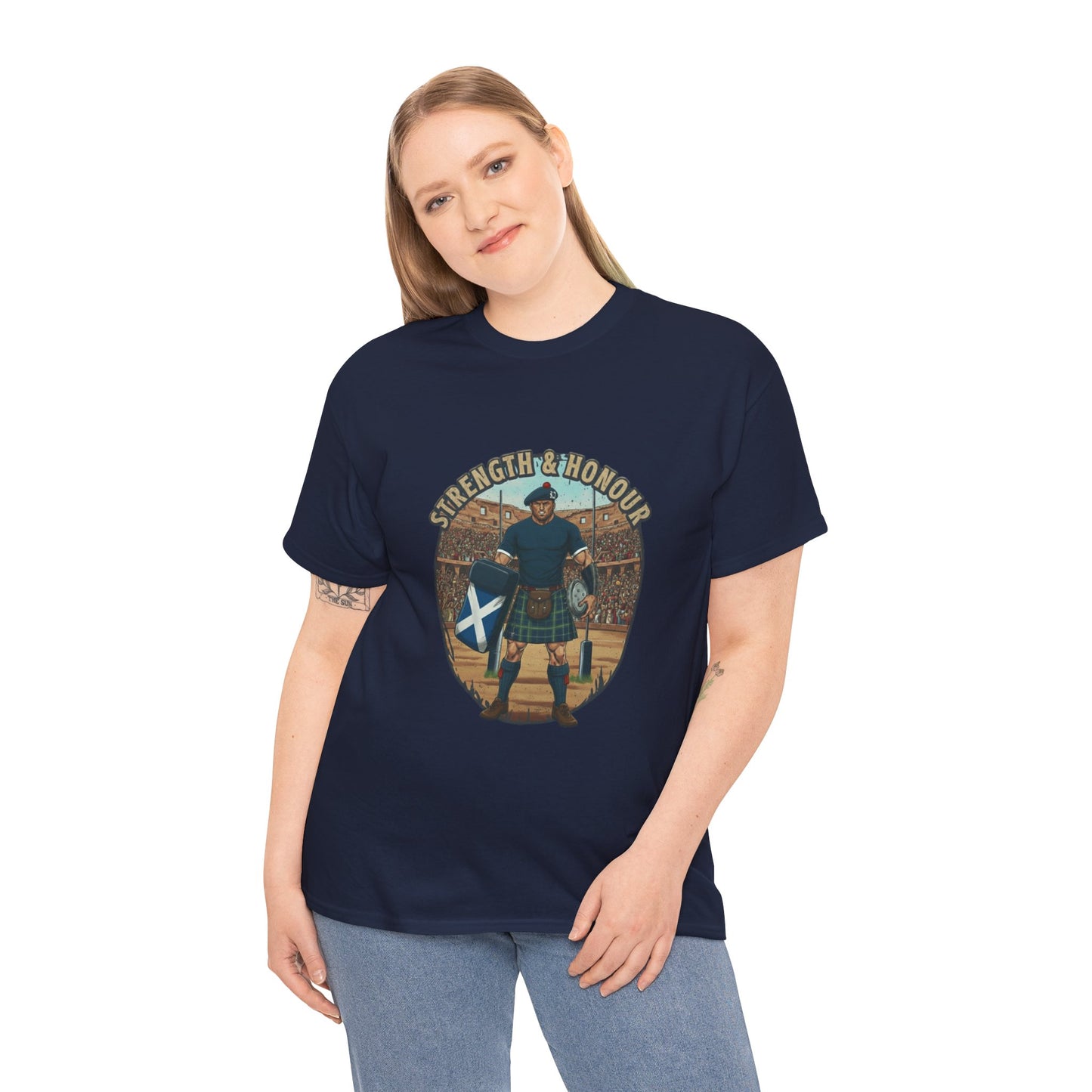 Woman wearing a Navy t-shirt with a graphic of a Scottish rugby player wearing a kilt and `Strength & Honour` text on a white background