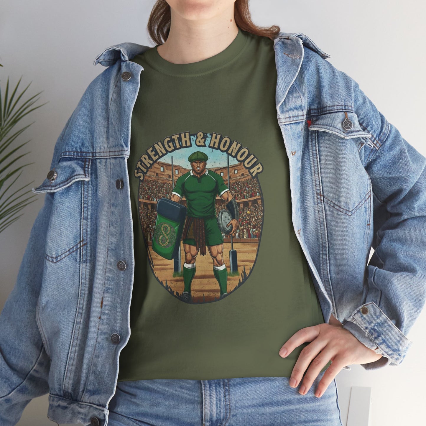 Lifestyle photo of a woman wearing Army green t-shirt with a graphic of a Irish rugby player with `Strength & Honour` text on a white background