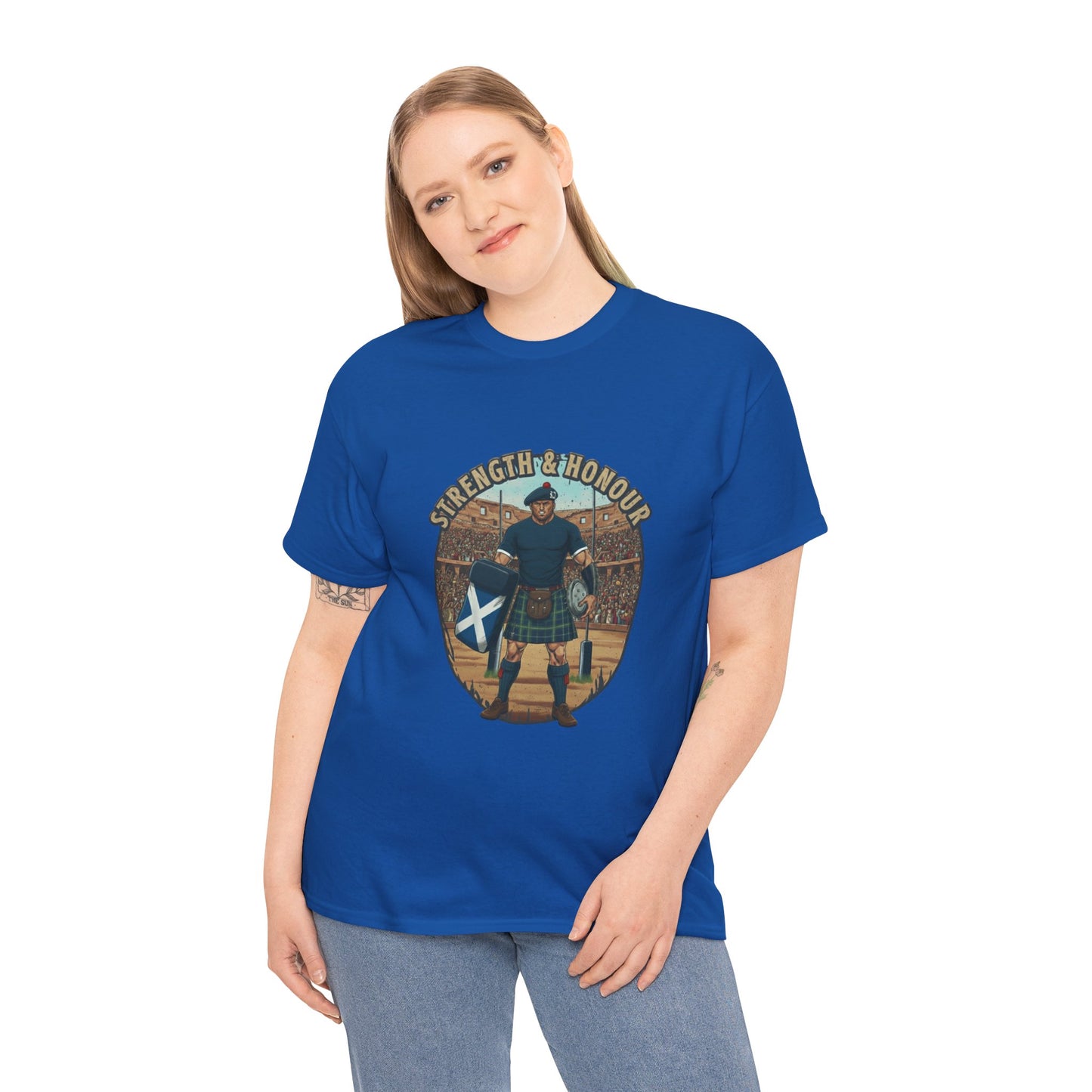 Woman wearing a Blue t-shirt with a graphic of a Scottish rugby player wearing a kilt and `Strength & Honour` text on a white background