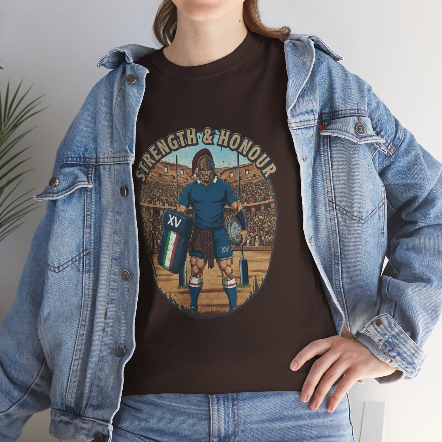 Lifestyle photo of a woman wearing Brown t-shirt with a graphic of an Italian rugby player with `Strength & Honour` text on a white background