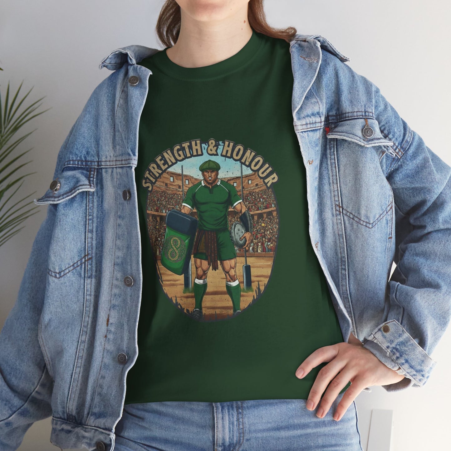 Lifestyle photo of a woman wearing Green t-shirt with a graphic of a Irish rugby player with `Strength & Honour` text on a white background