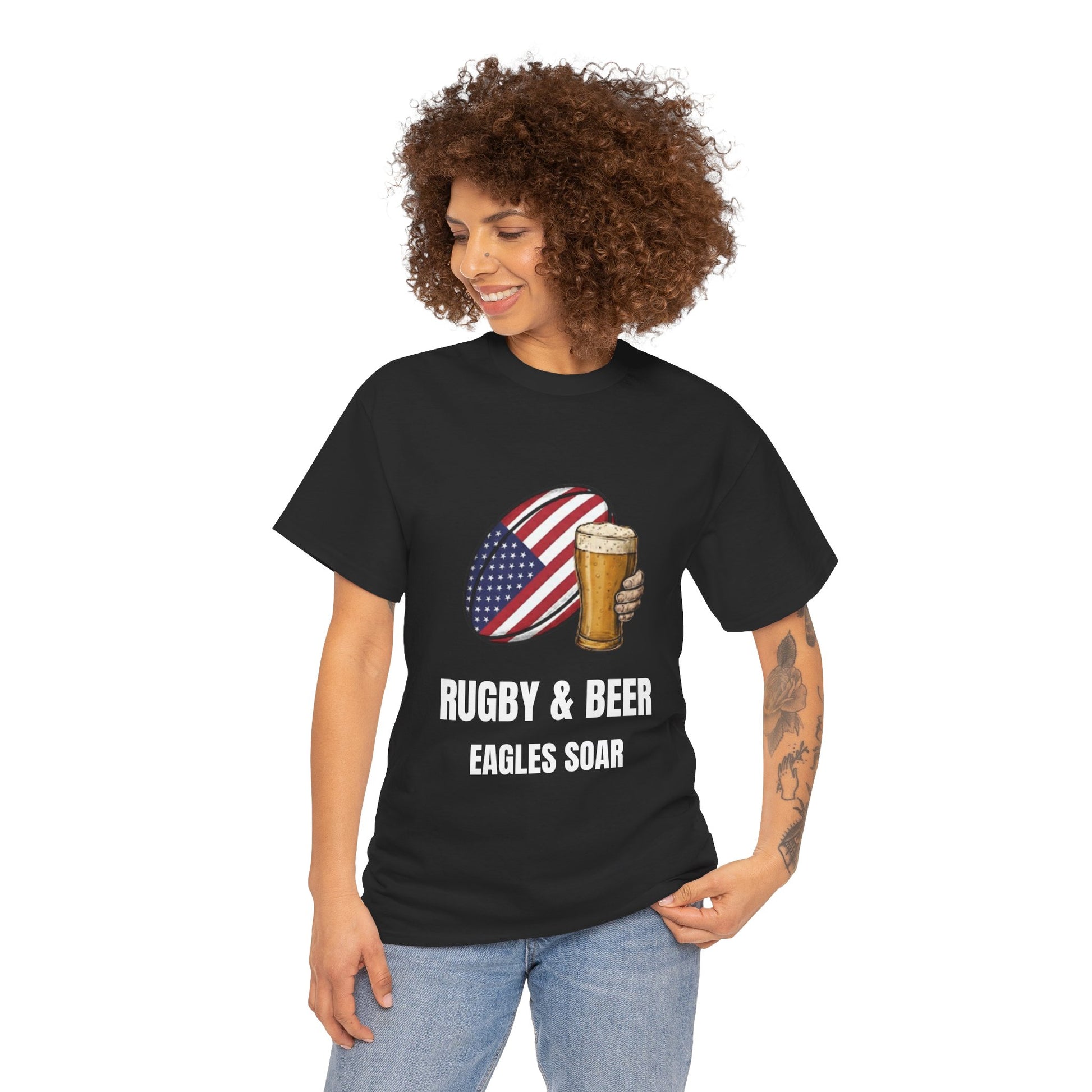 Woman wearing Black Eagles Soar t-shirt with rugby and beer graphic and text on a white background